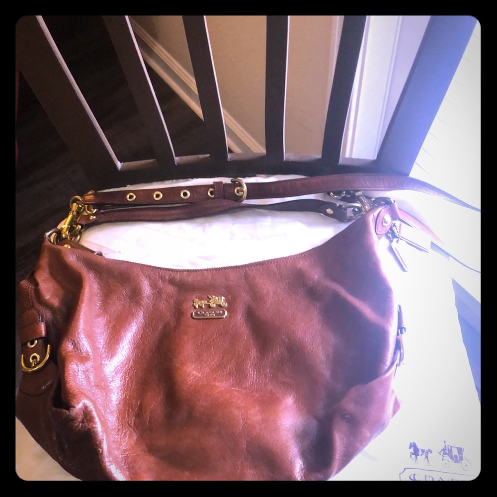Gently used Coach genuine leather purse/dust bag